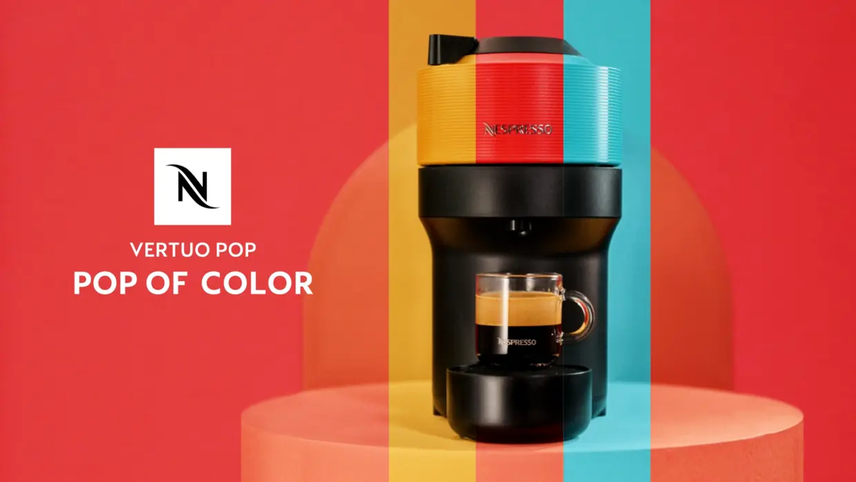 Nespresso Vertuo Pop Pop of Color campaign, coffee machine on a multicoloured striped backdrop