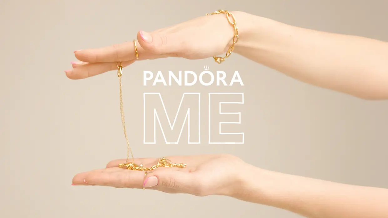 Pandora ME global launch creative, gold bracelets and chains held between two hands