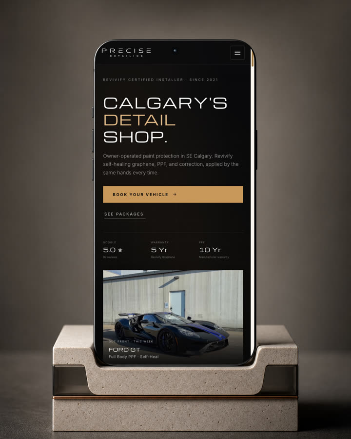 The Precise Detailing mobile homepage on a phone, Calgary’s Detail Shop, with the rating, warranty and Book your vehicle button