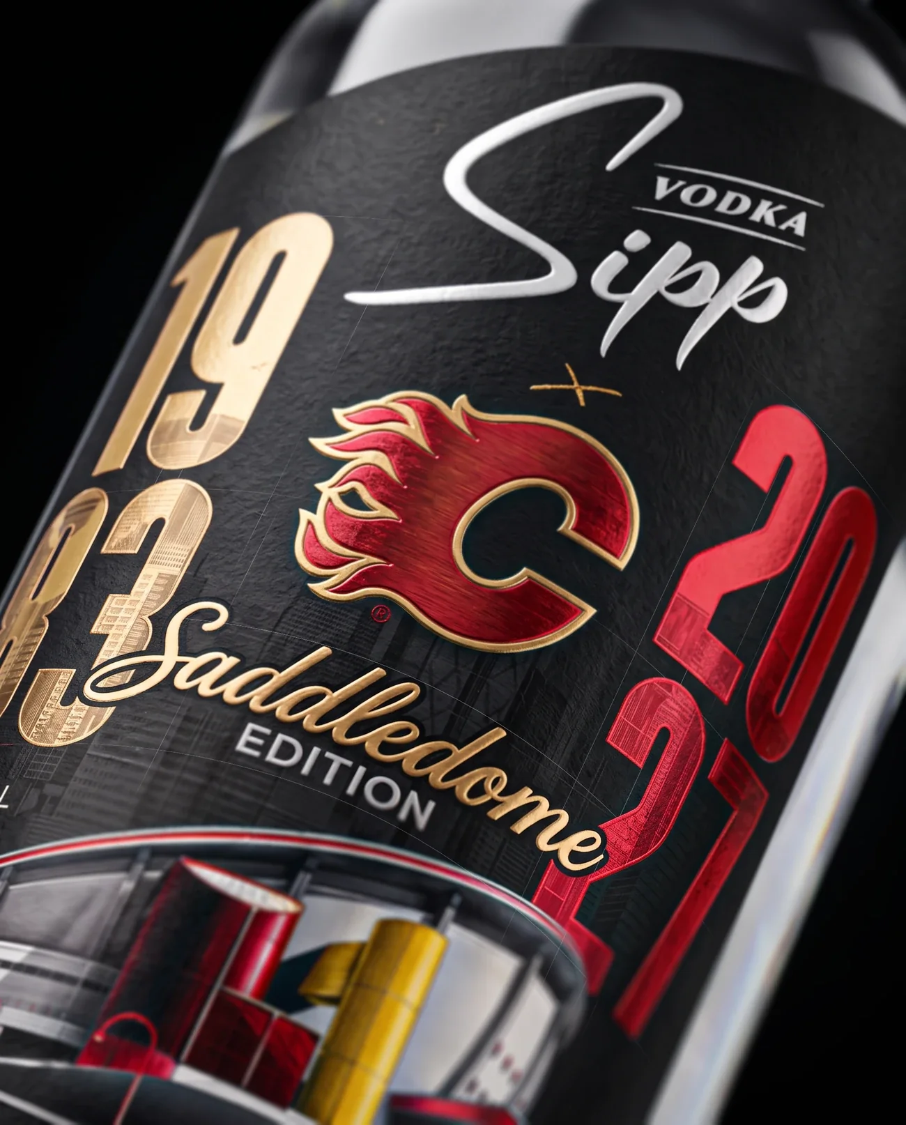 A render of the Saddledome Edition label up close, the Sipp script and Vodka over the Flames mark, with Saddledome in gold script.