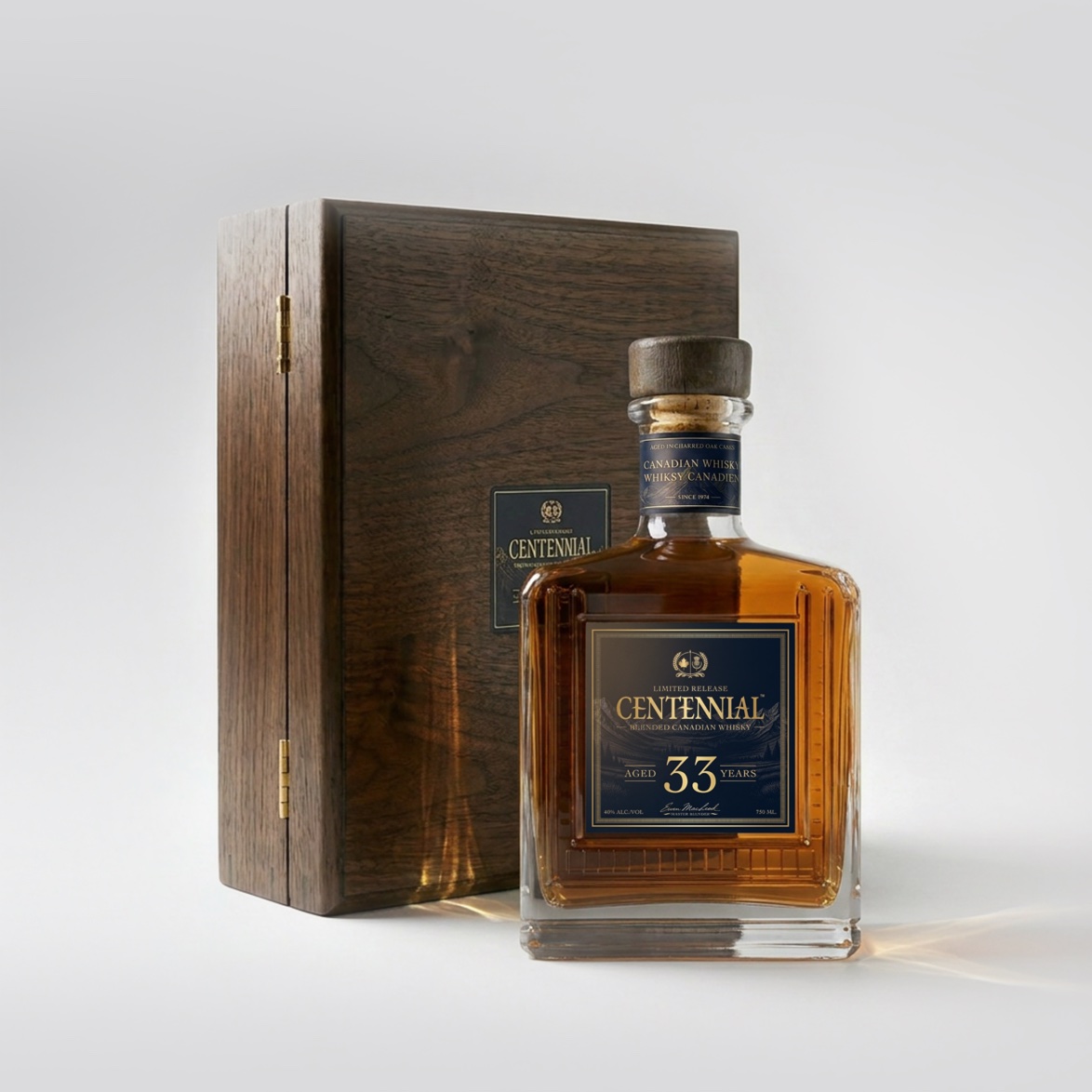 Centennial 33 year bottle beside its walnut presentation box